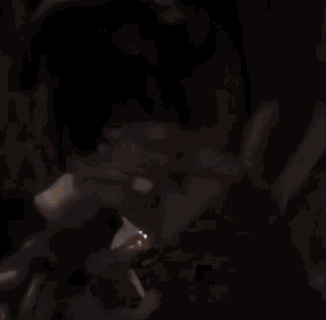 a blurry picture of people ice skating at night