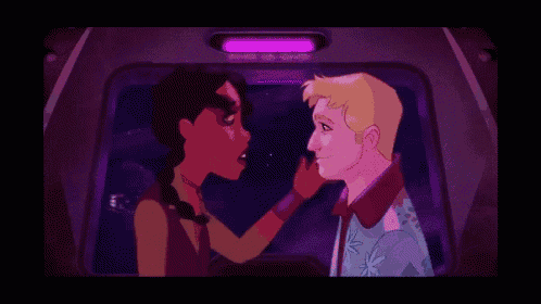 a man and a woman are standing next to each other in a car .