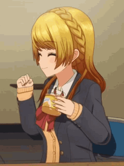 a girl in a school uniform is sitting at a table holding a cup of coffee