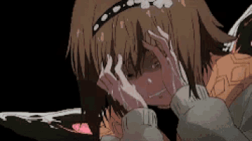 a girl with a headband is crying with her hands on her face