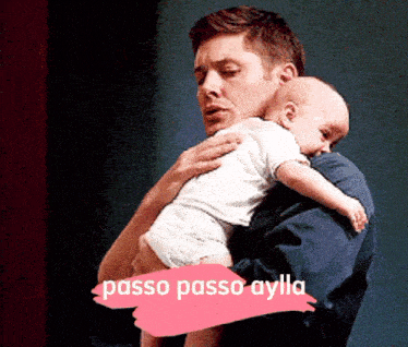 a man is holding a baby in his arms and the words passo passo aylla are on the bottom