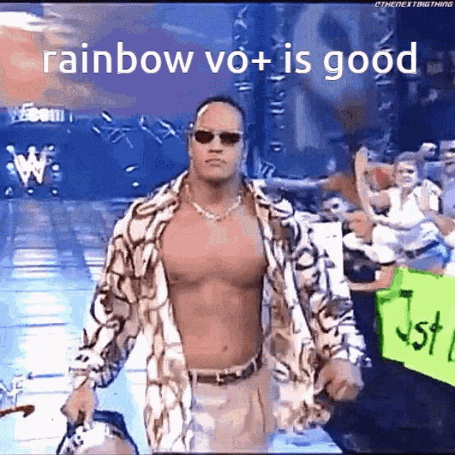 a shirtless wrestler is walking in front of a crowd with the words rainbow vo + is good above him