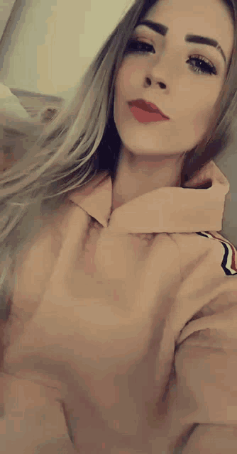 a woman taking a selfie with her mouth open