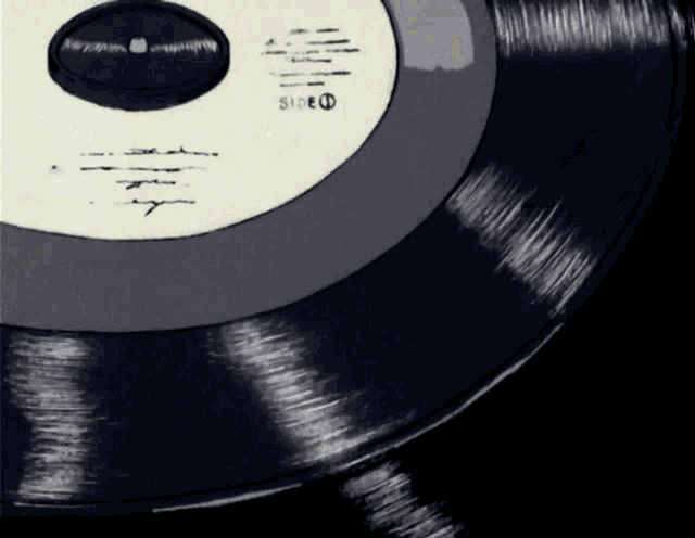 a black record with a white label that says side d