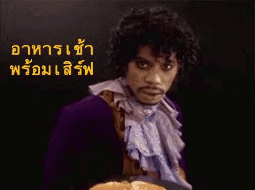 a man in a purple suit holds a plate of pancakes in front of a black background