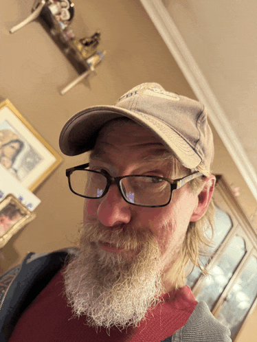 a man with a beard wearing glasses and a hat that says ' i love you '