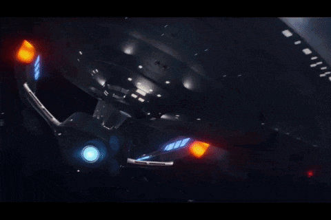 a space ship with a red light coming out of it