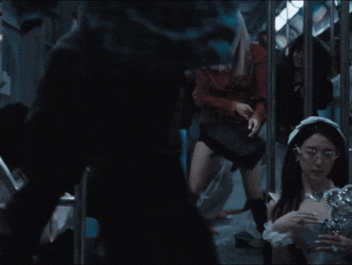 a woman in a white dress is holding a trophy on a subway