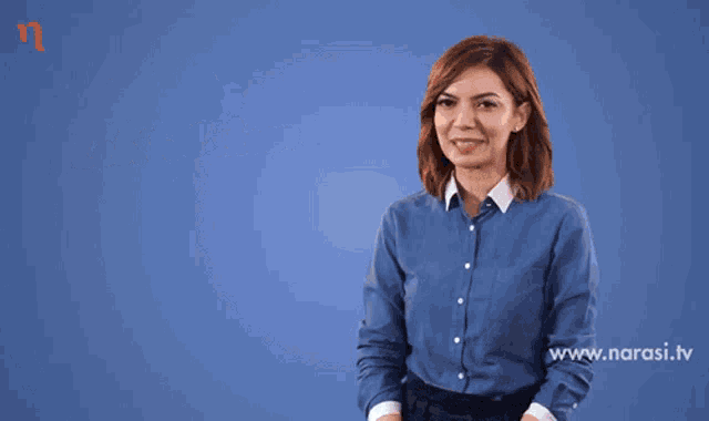 a woman in a blue shirt stands in front of a blue background with the words lebih rajin lebih tekun lebih konsisten on it