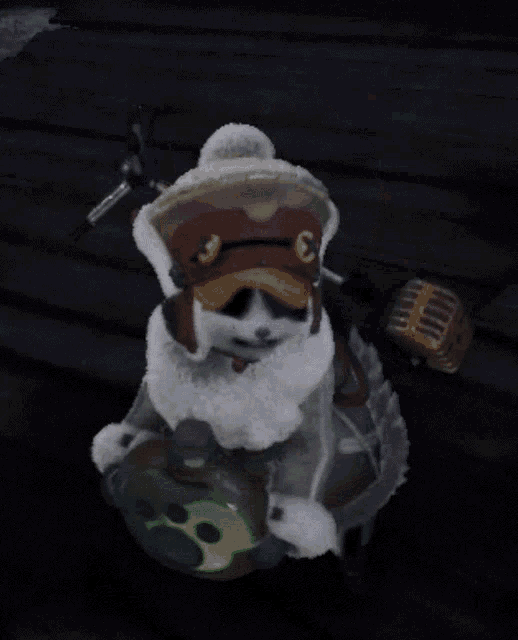 a stuffed animal wearing a hat is holding a bottle of something