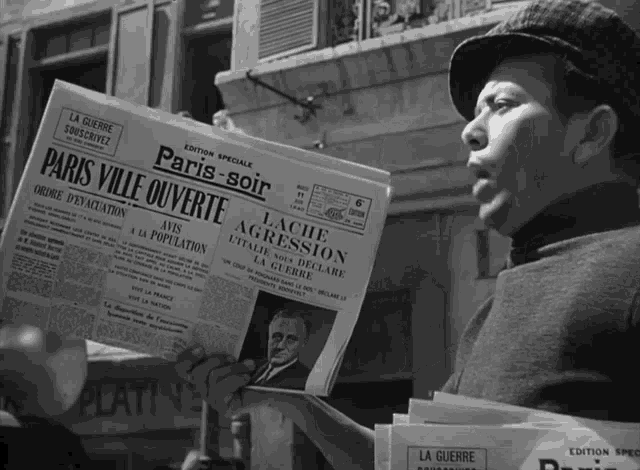 a man is reading a newspaper that says paris-soir