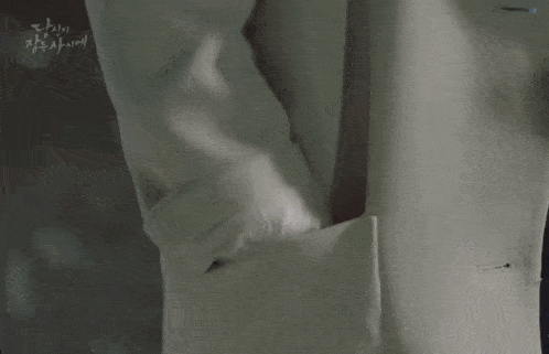 a person is holding a pair of scissors in their hand