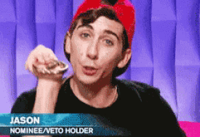 a man wearing a red hat and a black shirt with the name jason nominee / veto holder