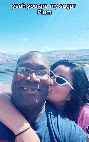 a woman kisses a man on the cheek with a caption that says yeah you are my sugar plum
