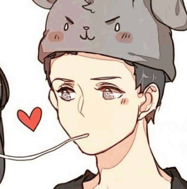 a man wearing a bunny hat is eating something with a spoon .