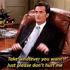 a man in a suit and tie is sitting in a chair with the words take whatever you want just please don 't hurt me