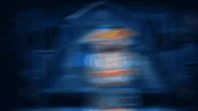 a blurry picture of a girl standing in front of a blue house