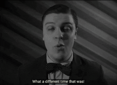 a man in a suit and bow tie is talking about what a different time that was