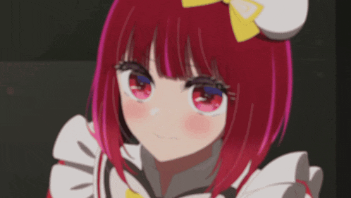 a close up of a girl with red hair and a yellow bow