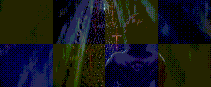 a group of people are standing next to each other in a dark room with the words `` all hail legi '' written on the screen .