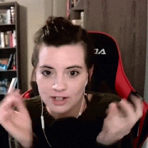a woman wearing headphones is sitting in a red and black chair .