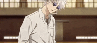 a man wearing sunglasses and a white shirt is standing in a basketball court .