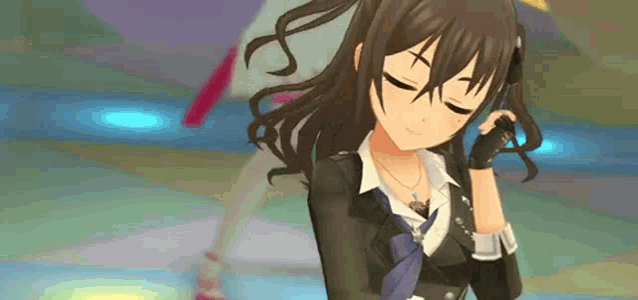 a girl in a suit and tie is standing on a dance floor with her eyes closed and smiling .