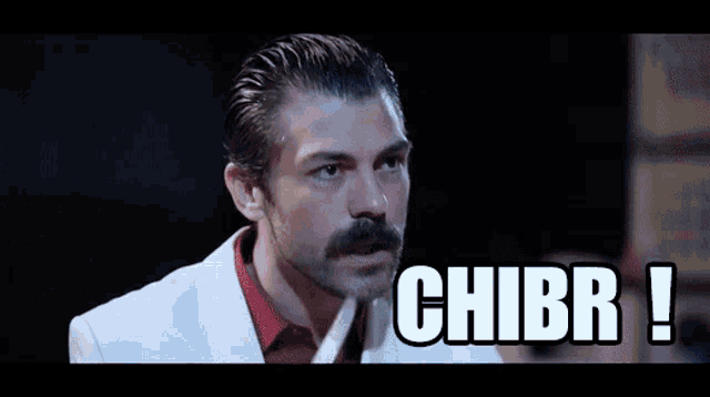 a man with a beard and mustache says chibr !