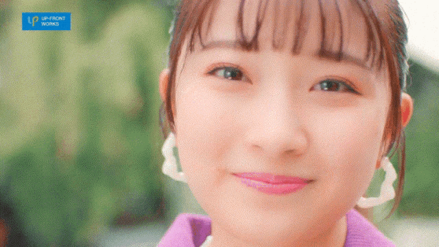 a close up of a woman 's face with the words upfront works in the corner