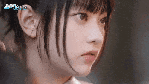 a close up of a girl 's face with the word jeans on the bottom left