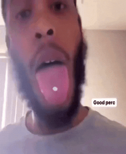 a man with a beard is sticking his tongue out and says good perc