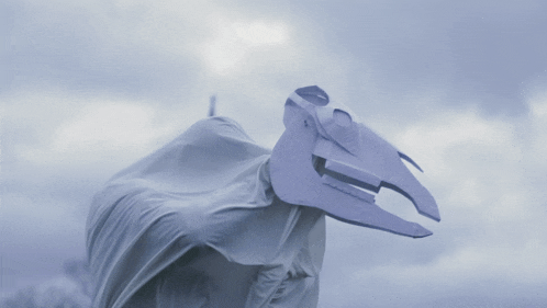 a statue of a horse with a white cloth covering it