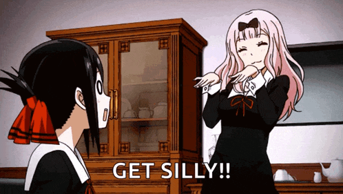two anime girls are standing next to each other and one of them is saying get silly !