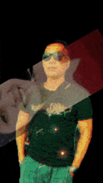 a man wearing sunglasses and a green shirt has a reflection of a woman