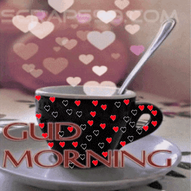 a cup of coffee on a saucer with the words good morning written on it