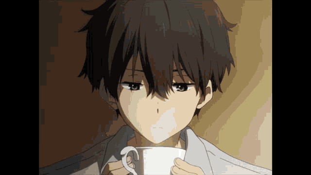 a close up of a person holding a cup