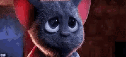 a cartoon cat with big blue eyes and red ears
