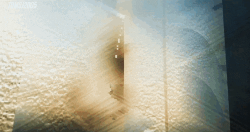 a blurred image of a building with the year 2005 on the bottom