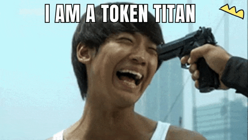 a man is laughing while a gun is pointing at his head with the caption i am a token titan