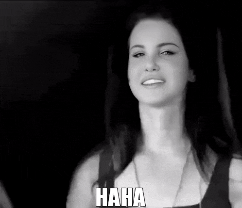 a woman is smiling in a black and white photo with the word haha below her
