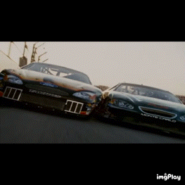 two race cars are racing on a track with a watermark that says imgplay at the bottom