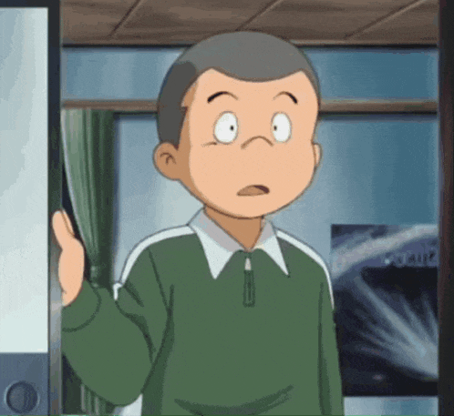 a boy with a surprised look on his face is standing in front of a door