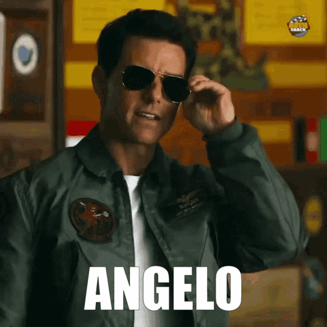a man wearing sunglasses and a jacket with the word angelo above him