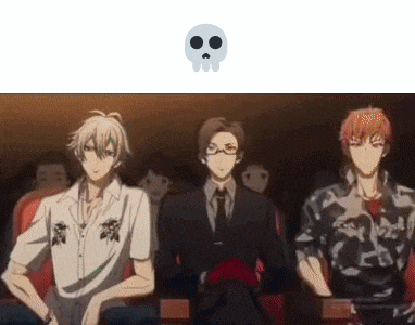 a group of anime characters are sitting in a theater with a skull .