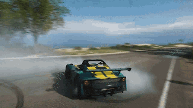 a green and yellow sports car is drifting down the road