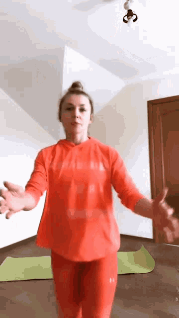 a woman in a red shirt with the word puma on it