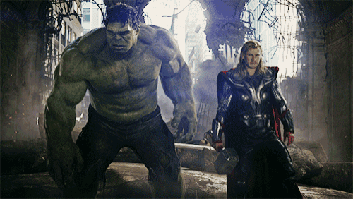 hulk and thor are standing next to each other in a dark cave