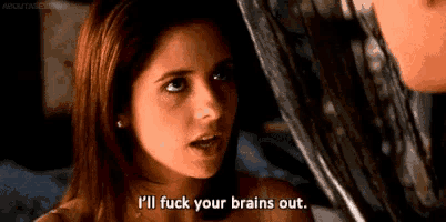 a woman is saying `` i 'll fuck your brains out '' while looking at a man .