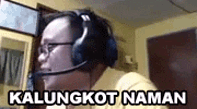 a man wearing headphones and a microphone says kalungkot naman .