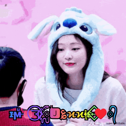 a girl wearing a bunny hat with the words i 'm 3 dennis on the bottom right